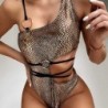 Sexy bikini / one piece swimming suit - with decorative rings - snake skin