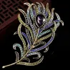 Vintage feather shaped brooch with crystalsBrooches
