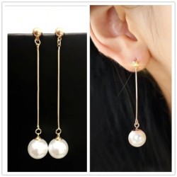 Long golden earrings with a pearlEarrings