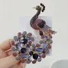 Crystal peacock broochBrooches