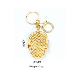 Golden keychain with crystal skullKeyrings