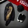 Black bomber jacket with embroidered golden wingsJackets